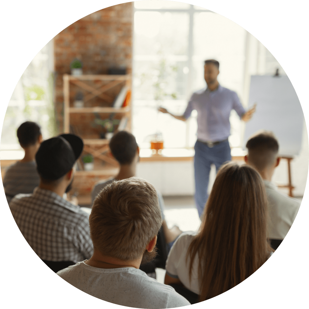 A Person hosting a class speaks to his students.