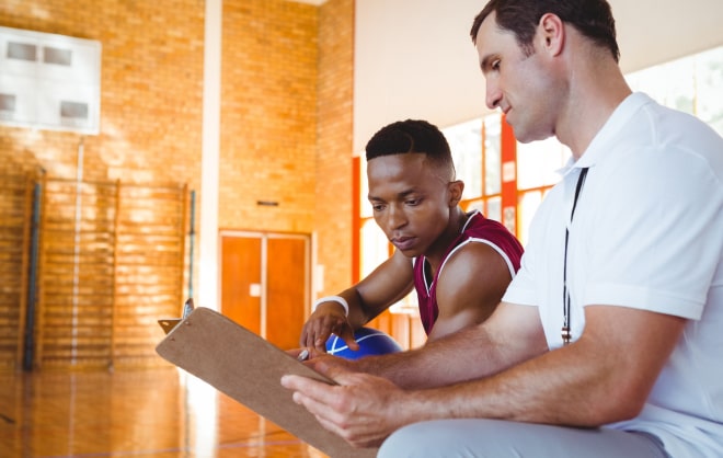 Athlete asking a basketball coach a question